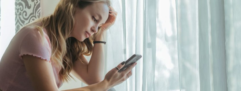 Tween Girl Looking at Phone